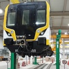 Image of Train Being Lifted By Crane System