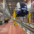 Image of Train Being Lifted By Crane System