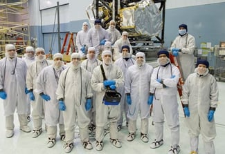 Image of large group of people in full sanitary gear