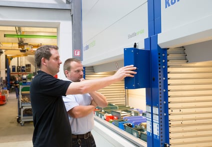 Image of Two men looking at system