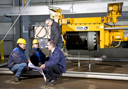 Image of Four people Working on STAHL Crane Systems