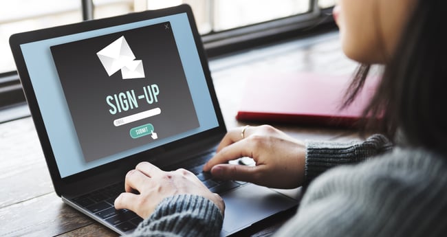 Image of Woman on Computer looking at "Sign Up" Screen