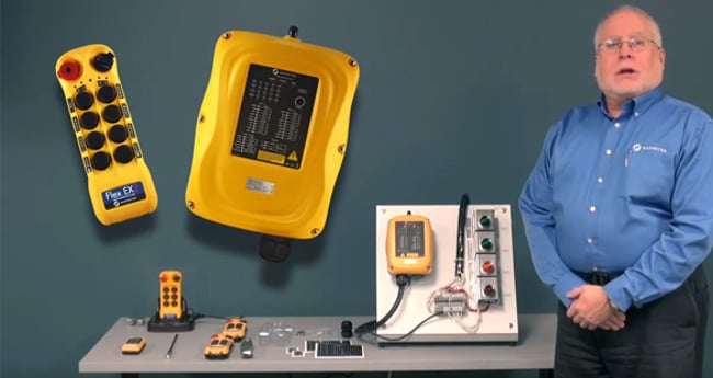 Image of Man with Radio Controls on table next to him
