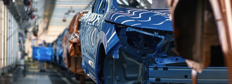 Image of cars on conveyor system